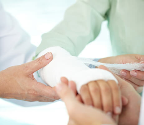 A patient getting their arm casted after getting a bone fracture.