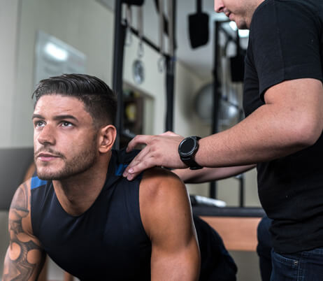 orthopedic doctor in Naples, FL, treating an athlete 