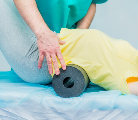 Young woman receiving physical therapy in Naples, FL.