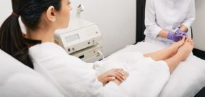 Doctor examining a woman's feet