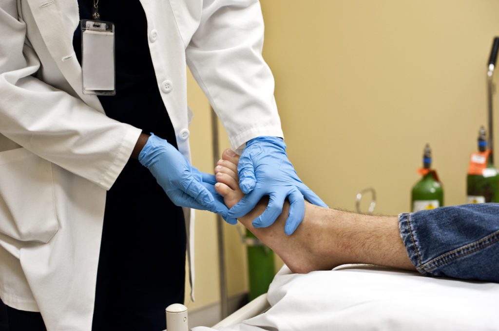 Doctor examining patient's foot