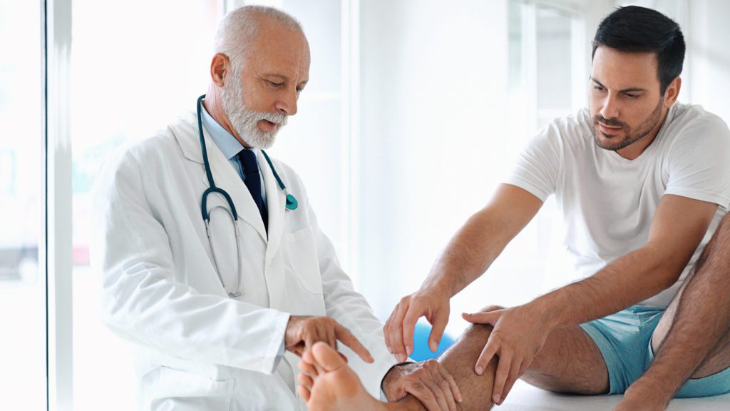 Doctor examining a patient's foot