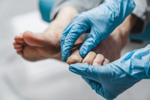 Podiatrist treating patient's feet problem