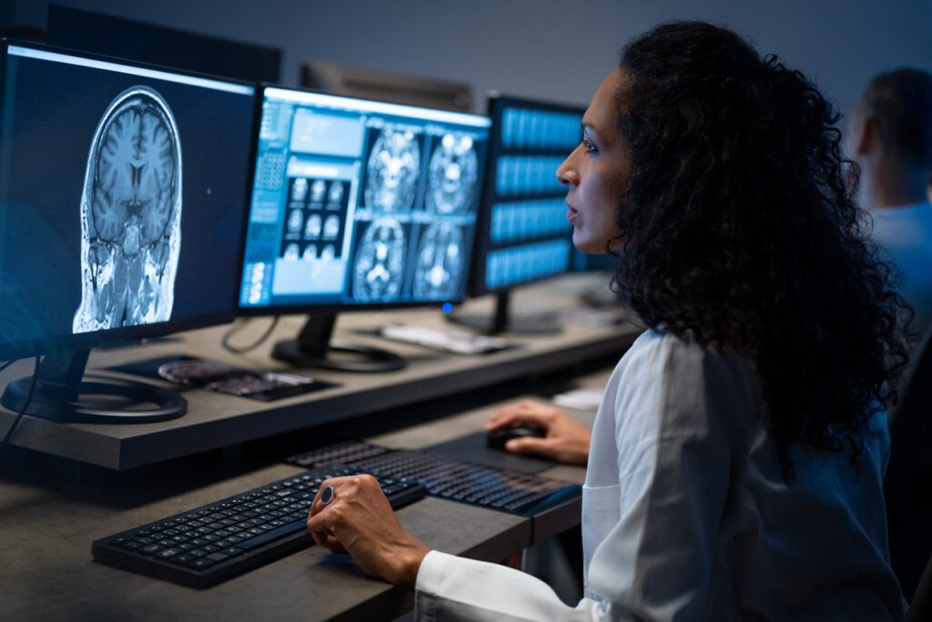 Female radiologist analysing the MRI image