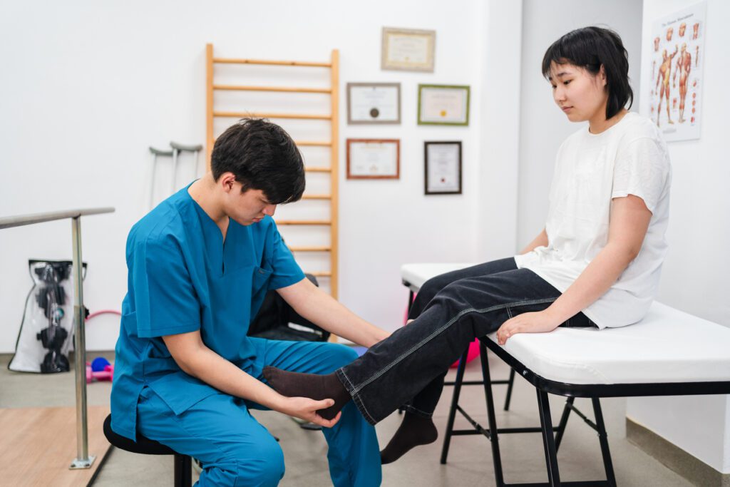 Teenager girl going to the sports medicine physician with leg pain