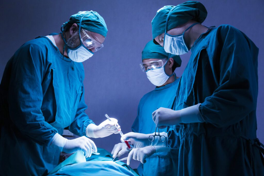 orthopedic doctor team operating surgery a patient in the operating room