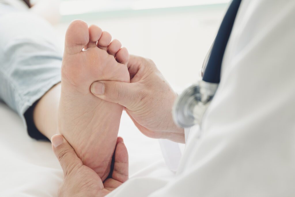 Podiatrist giving a patient foot treatment