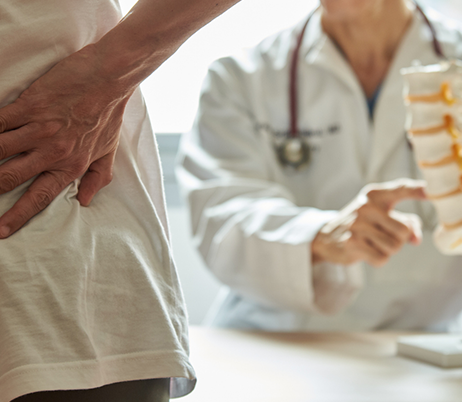 spine specialist talking to patient about their spine 