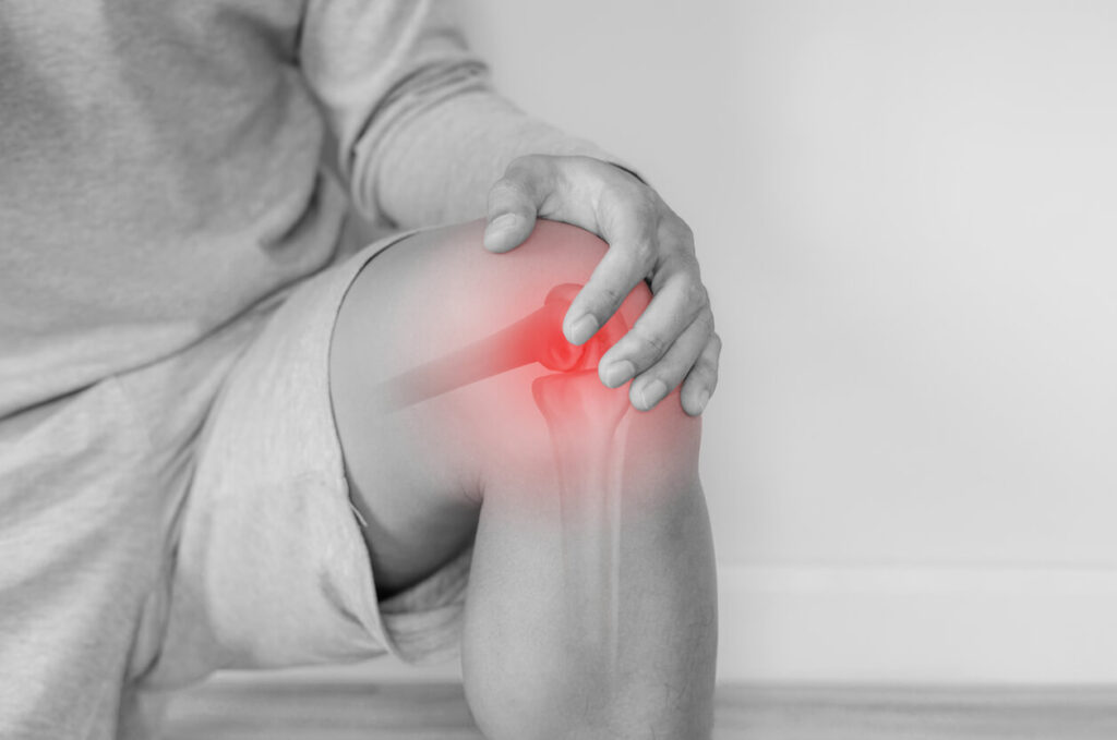 Joint pain, Arthritis and tendon problems. a man touching knee at pain point.